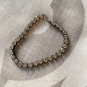 Black bracelet with faux diamonds